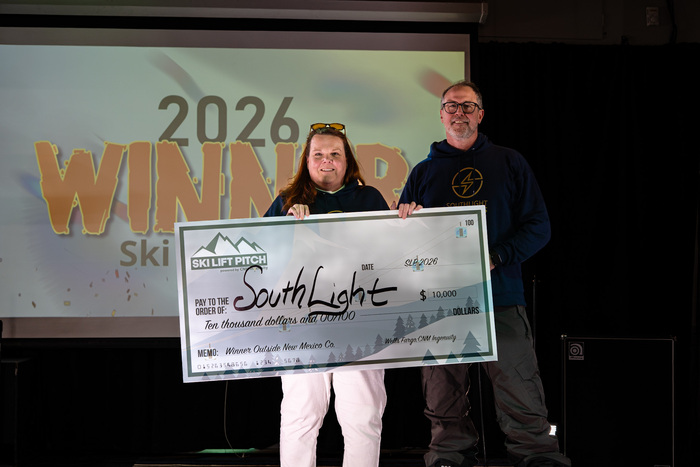 Ski Lift Pitch Out-of-State winner, SouthLight. holding up big check.